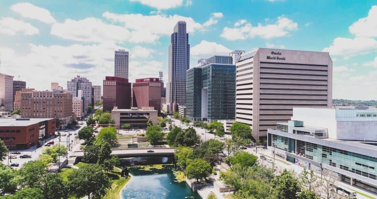 downtown-omaha-skyline-cityscape-sunny-day-missouri-river-green-trees