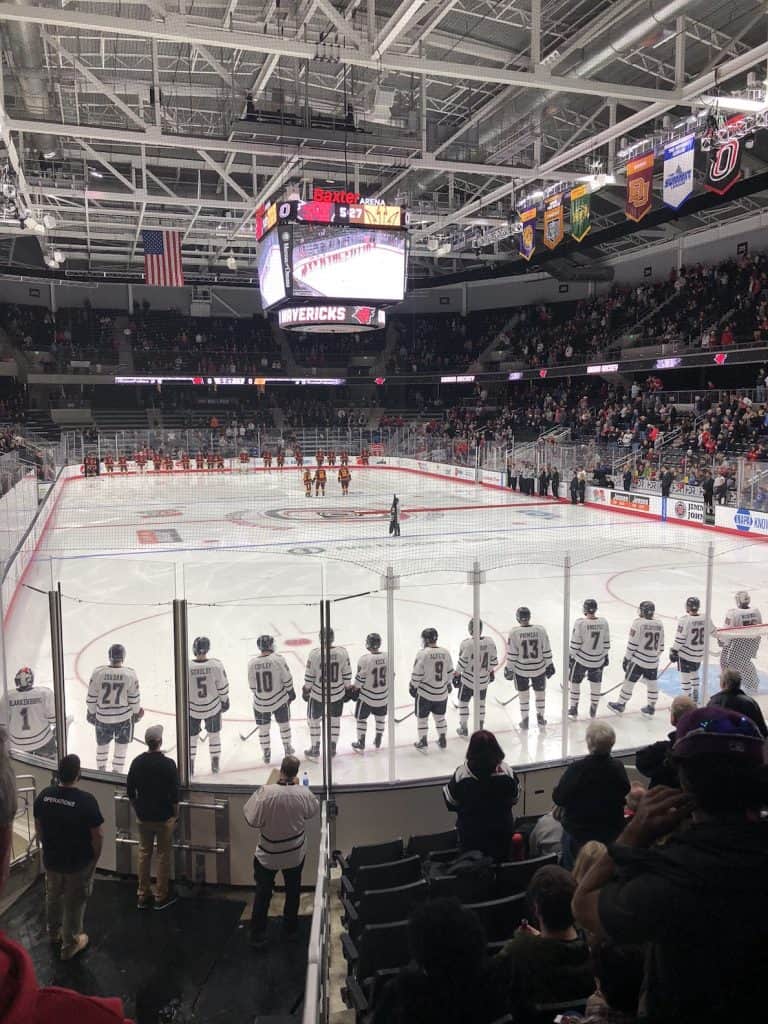 iceskaters-lined-up-during-nationa-anthem-at-uno-hockey-game-baxter-arena