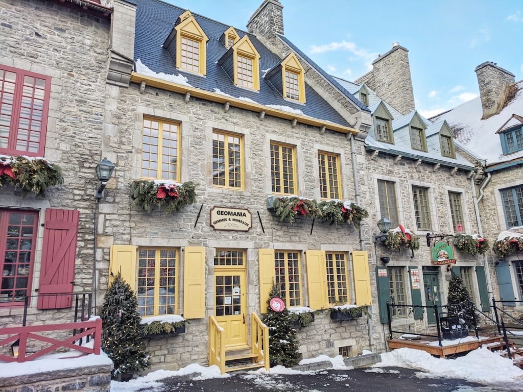Historic stone buildings with colorful doors, windows, and shutters. Old Quebec City, Canada