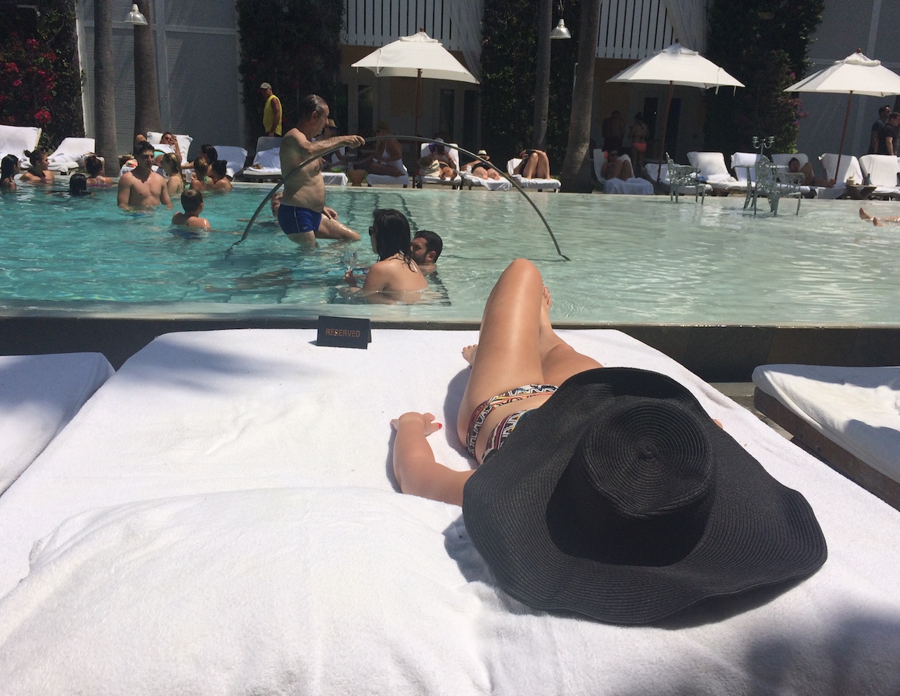 miami florida pool party private cabana luxury hotel delano south beach girls bachelorette party sunbathing