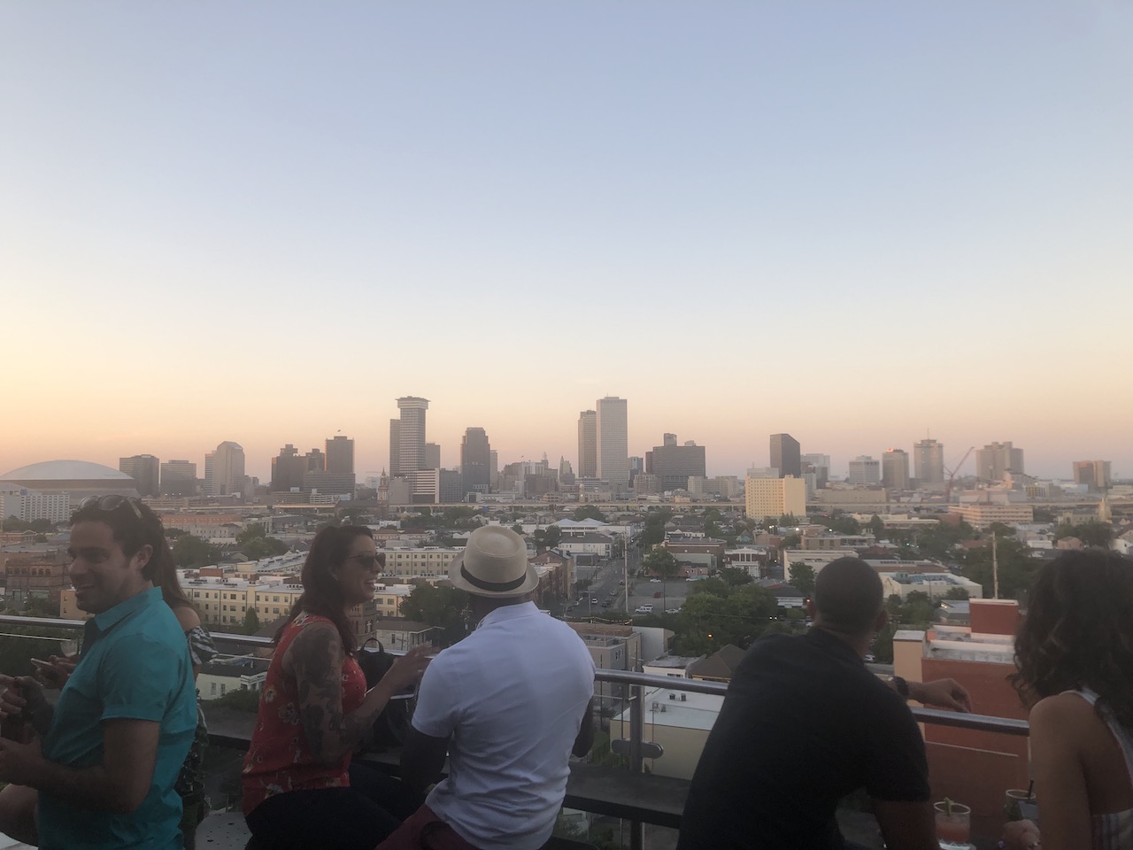 People at bar new orleans skyline Pontchartrain hotel hot tin rooftop bar sunset new orleans louisiana