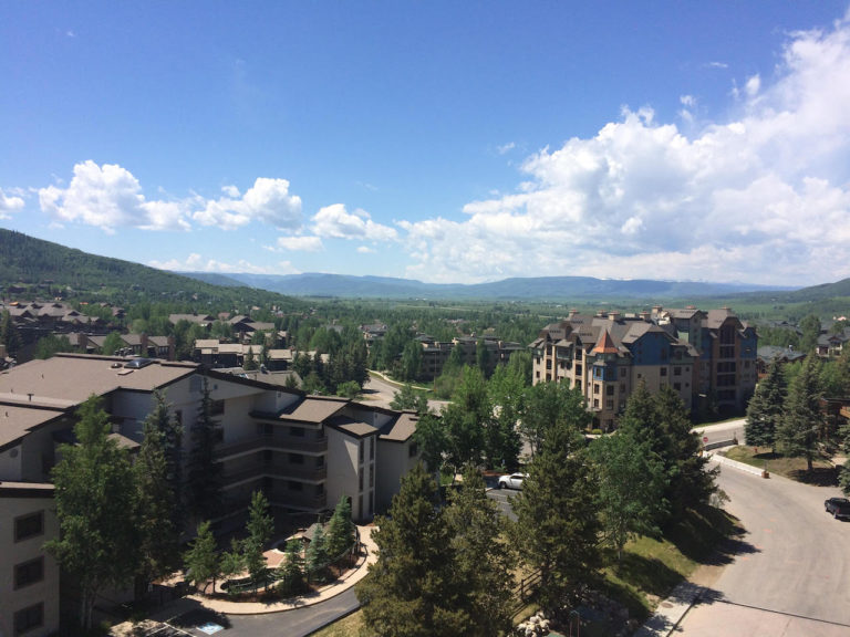 View of resorts in mountain town during summer. Steamboat Springs Ski Resort, Steamboat Springs, Colorado.