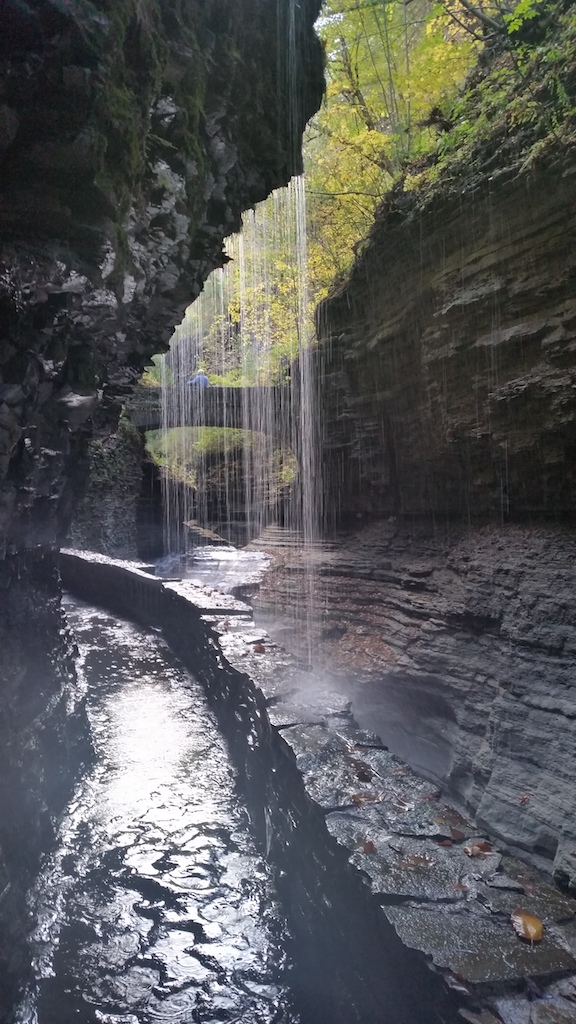 Path under waterfall in narrow gorge. Watkins Glen State Park, Finger Lakes, Upstate, New York - Upstate New York in fall