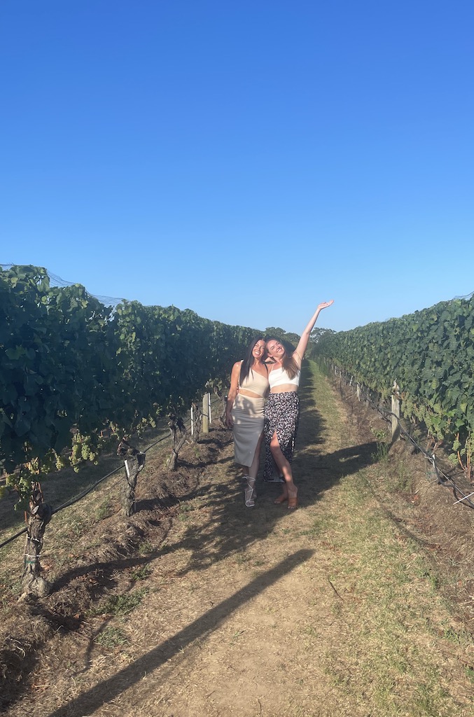 girls posing in grapevine vineyard wolffer estate new york summer the hamptons