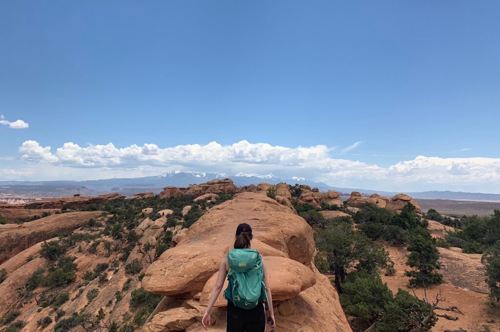 woman hiking devils garden trail arches national park moab utah