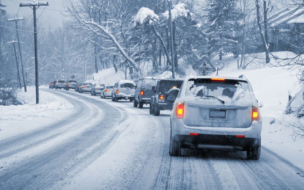 snowy road traffic traveling during the holidays holiday travel