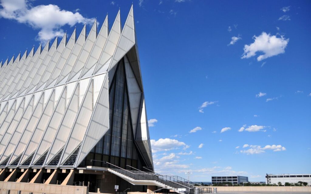 Cadet Chapel on Air Force Academy campus, geometric, spire-like structures against bright blue sky. Cadet Chapel, Air Force Academy, Colorado Springs, Colorado.