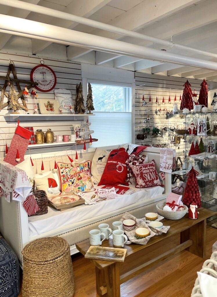 Interior of store selling Christmas decorations, wood floors, white beamed ceilings. Hildreth's Home Goods, Village of Southampton, Main Street, Southampton, New York, The Hamptons. Christmas in the Hamptons.