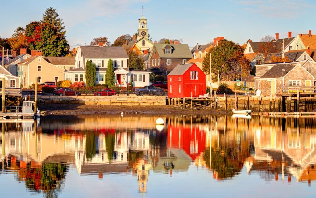 Rock of colorful homes overlooking harbor on sunny day. Portsmouth, New Hampshire, New England.