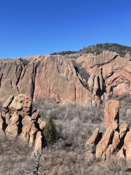 Red rock mountain in late winter on bright sunny day. Spring hike near Denver Roxburough State Park, Littleton, Colorado.