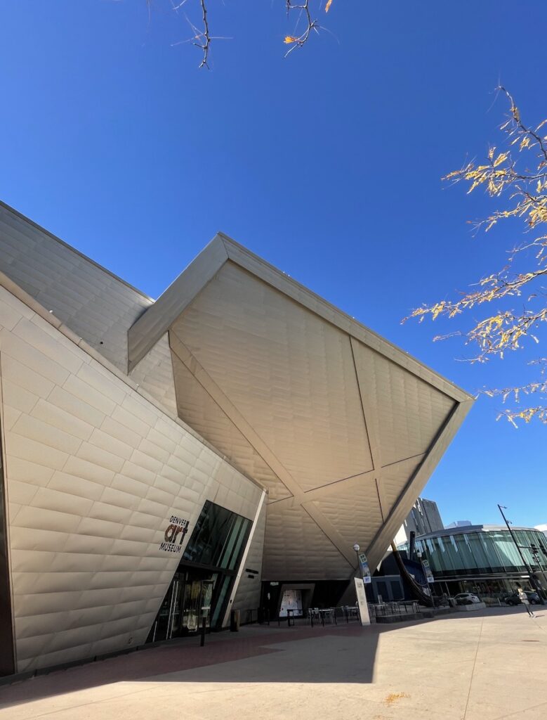 Dramatic angular, all silver building with no windows on cloudless sunny day. The Denver Art Museum, Golden Triangle, Denver, Colorado.