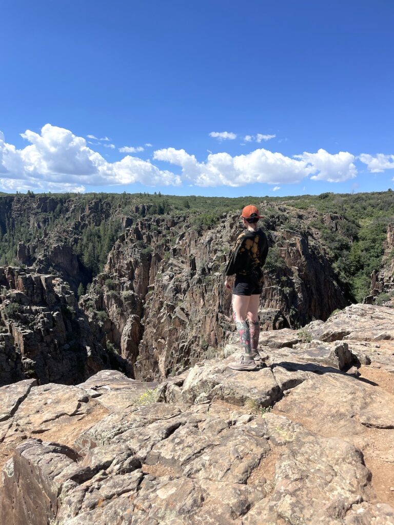 hiker at Pulpit Rock Overlook Black Canyon of the Gunnison National Park Montrose Colorado