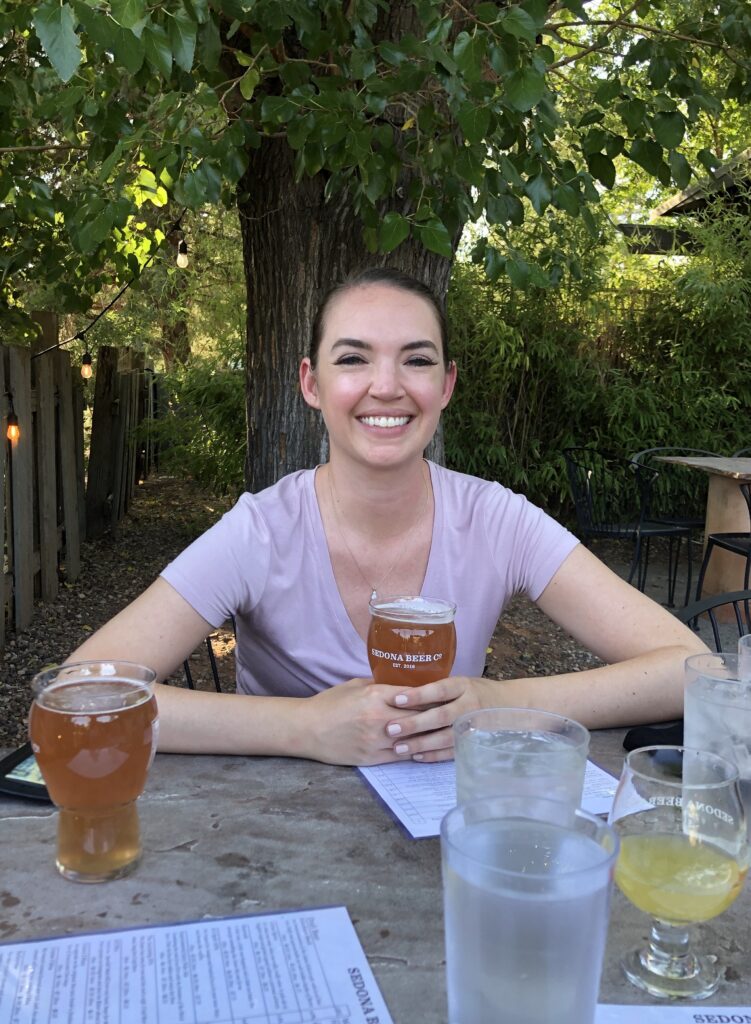woman at sedona beer company outdoor courtyard sedona airzona