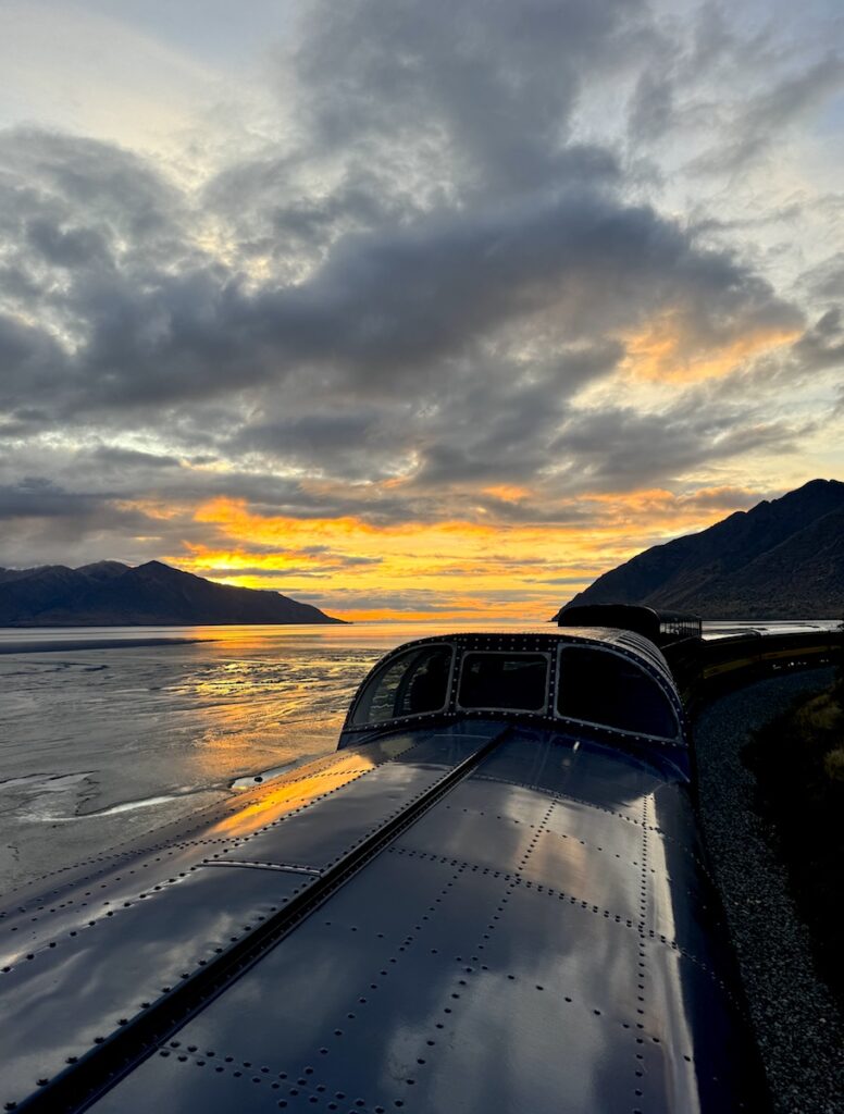 Riding the Alaska Railroad during sunset near Anchorage Alaska