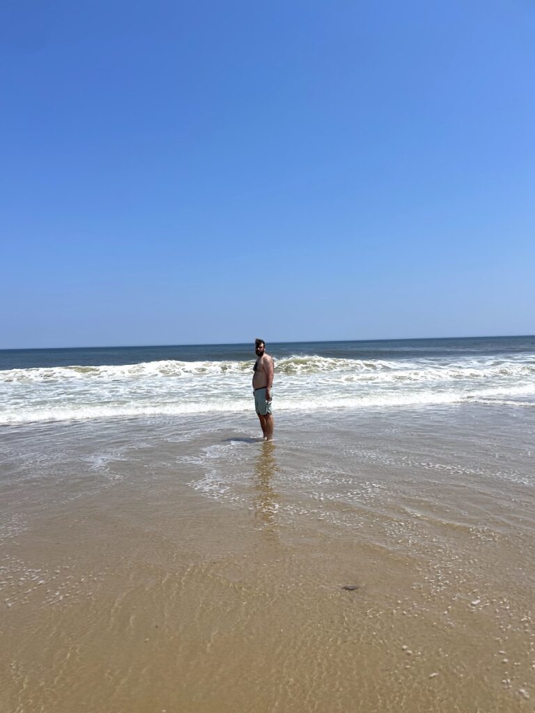 man in Atlantic Ocean cahoon hallow beach cape cod national seashore eastham cape cod massachusetts