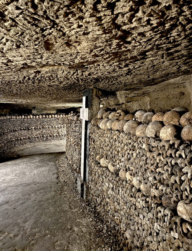 catacombs of paris skeleton lined passageways paris france