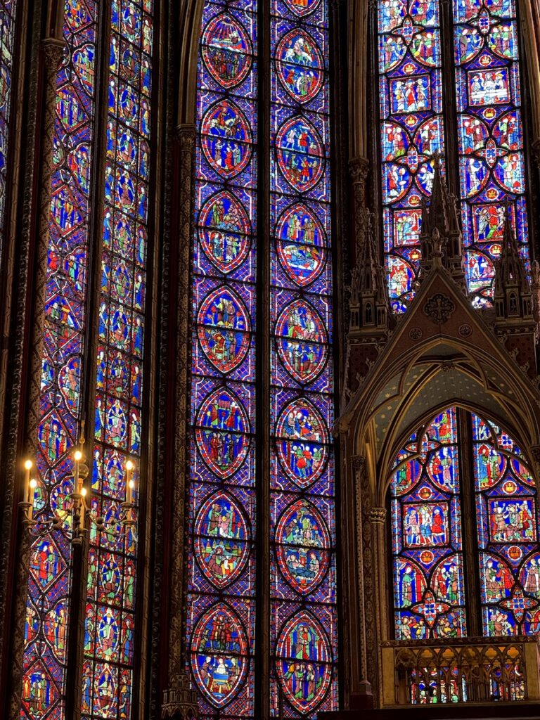 elaborate stained glass in sainte chapelle church Paris France