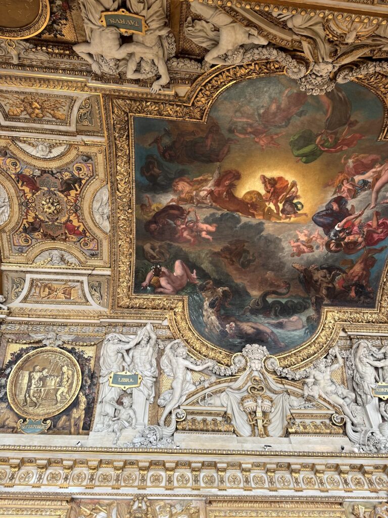 ornate ceiling art in the Galerie dApollon in the Louvre Paris France