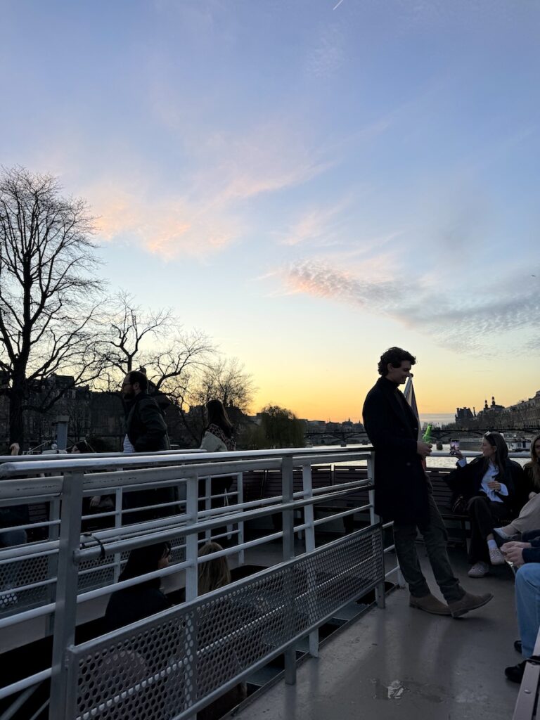upper deck of boat during sunset happy hour cruise seine river paris france