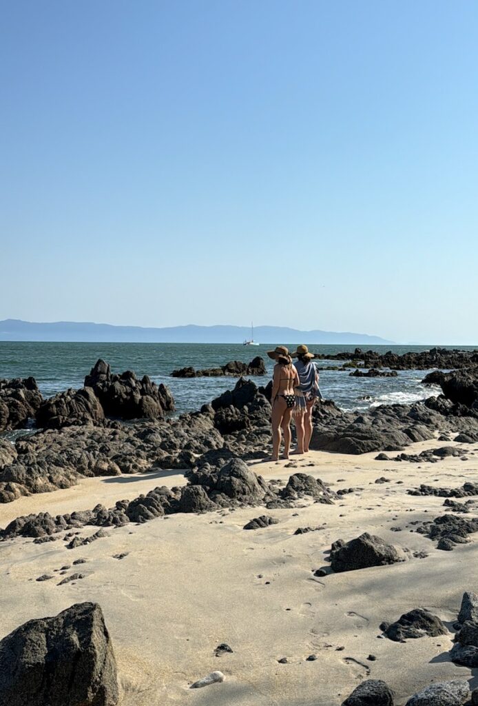 women on sandy beach near puerto vallarta and punta mita mexico