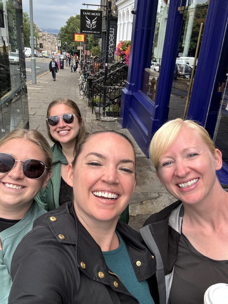 friends walking through New Town Edinburgh scotland united kingdom