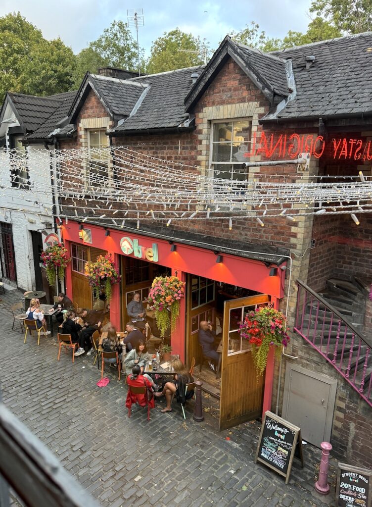 string lights cobblestone alley restaurants ashton lane Glasgow Scotland United Kingdom