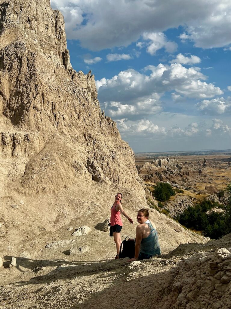 women hiking saddle pass badlands national park south dakota