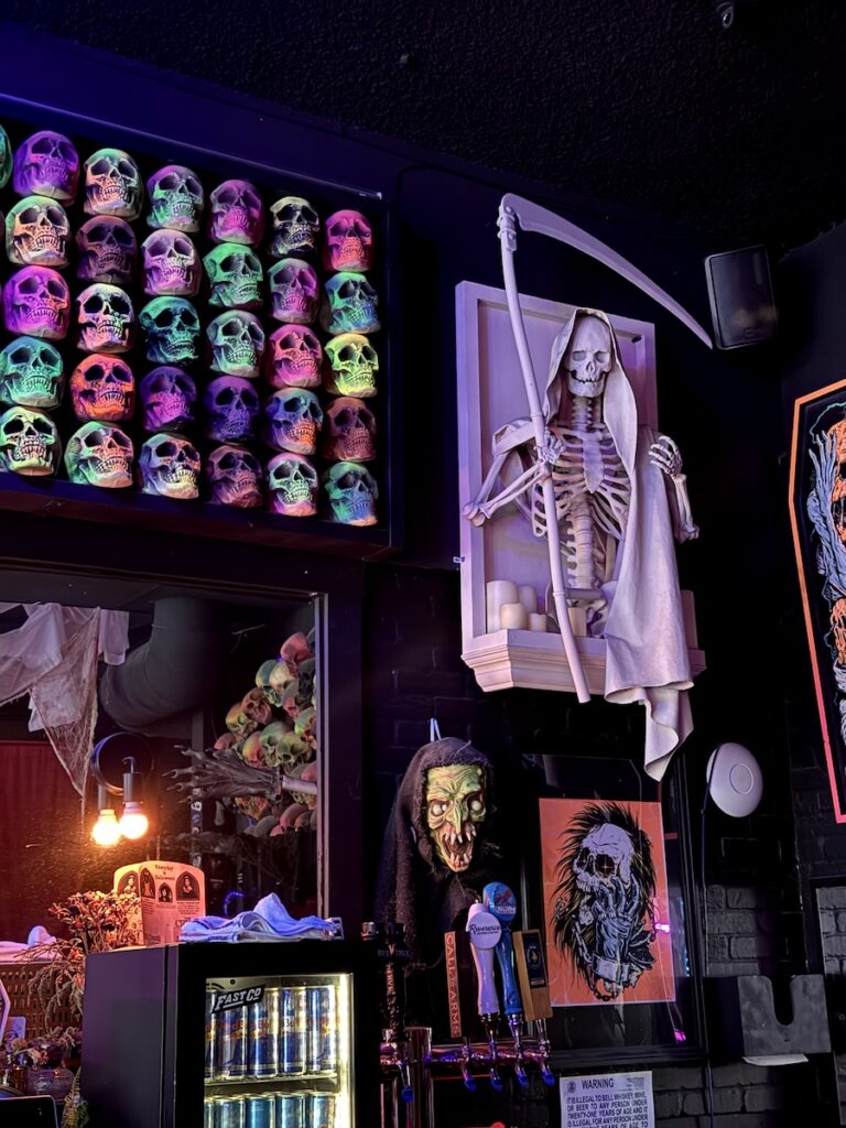 the crypt bar denver skelatons and spooky decor