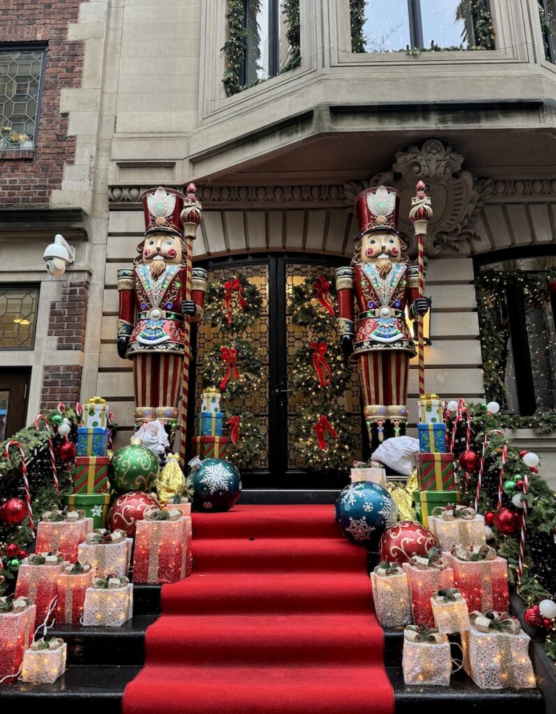 elaborate stoop display with giant nutcrackers at townhome on Upper East Side manhattan new york city christmas winter