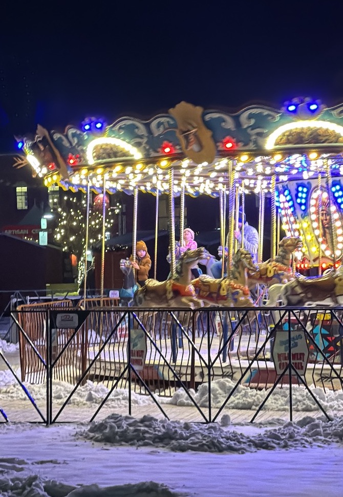 Denver Christkindlmarket carousel at night snow colorado