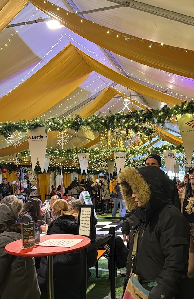 Denver Christkindlmarket crowded beer and music tent colorado