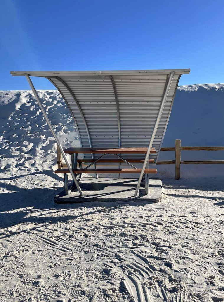 covered picnic benches in sand dunes white sands national park new mexico