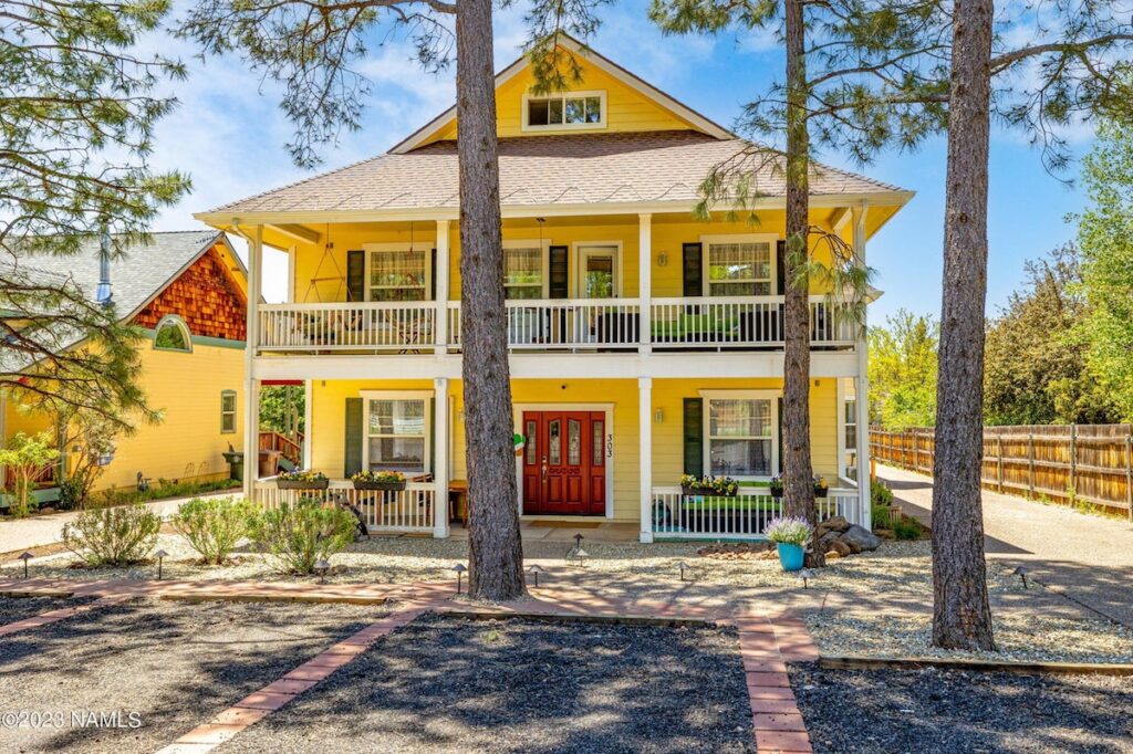 Charming historic yellow house surrounded by pine trees. 303 BnB Inn, Flagstaff, Arizona.