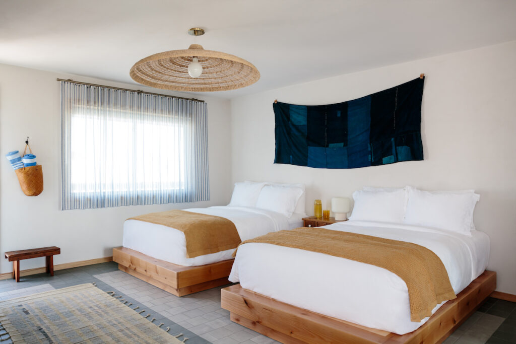 Renovated motel room with two queen beds and simple decor with minimalist coastal decor. Daunt's Albatross, Montauk, New York, The Hamptons