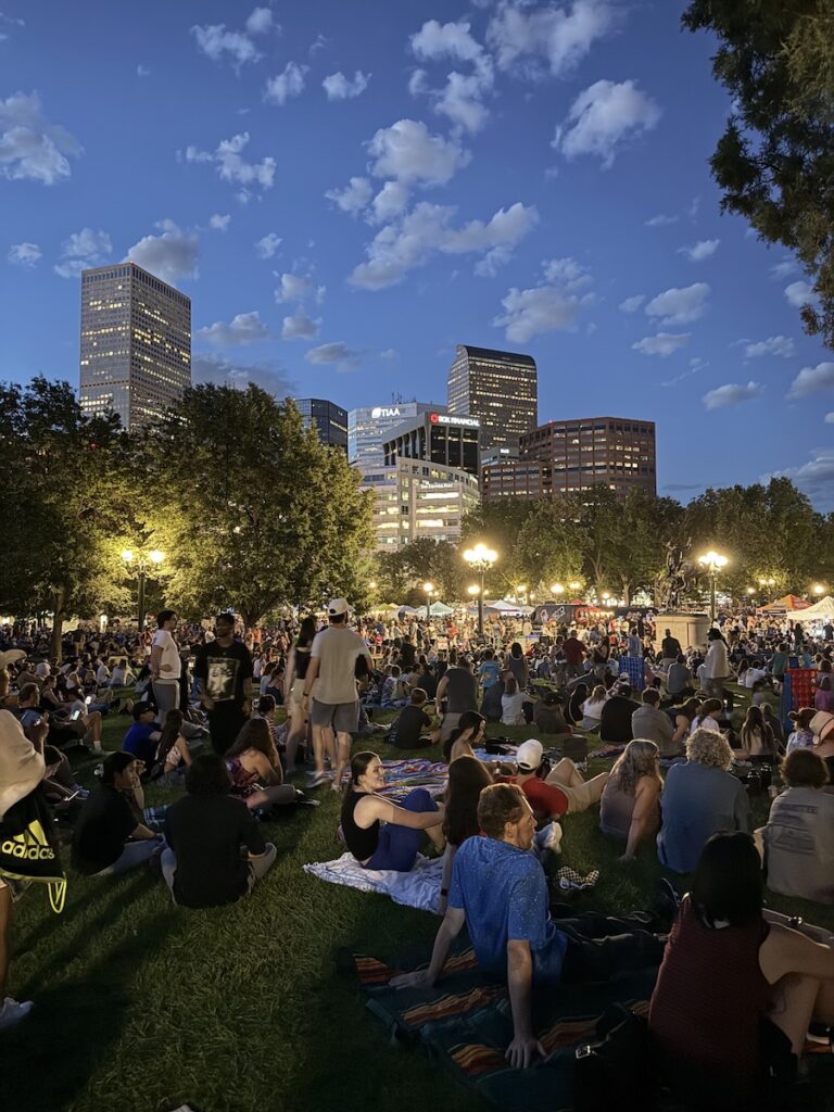 people sitting on large lawn denver indy eve celebration civic center park denver colorado